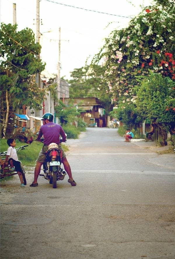 Man and young boy in the street.