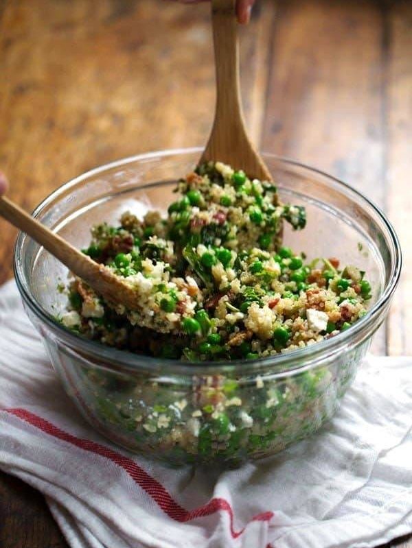 Spring Quinoa Salad with Honey Lemon Vinaigrette - peas, bacon, fresh herbs, almonds. Serve on spinach for fresh take-to-work lunches! | pinchofyum.com