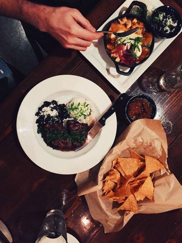 Table with plates of food.