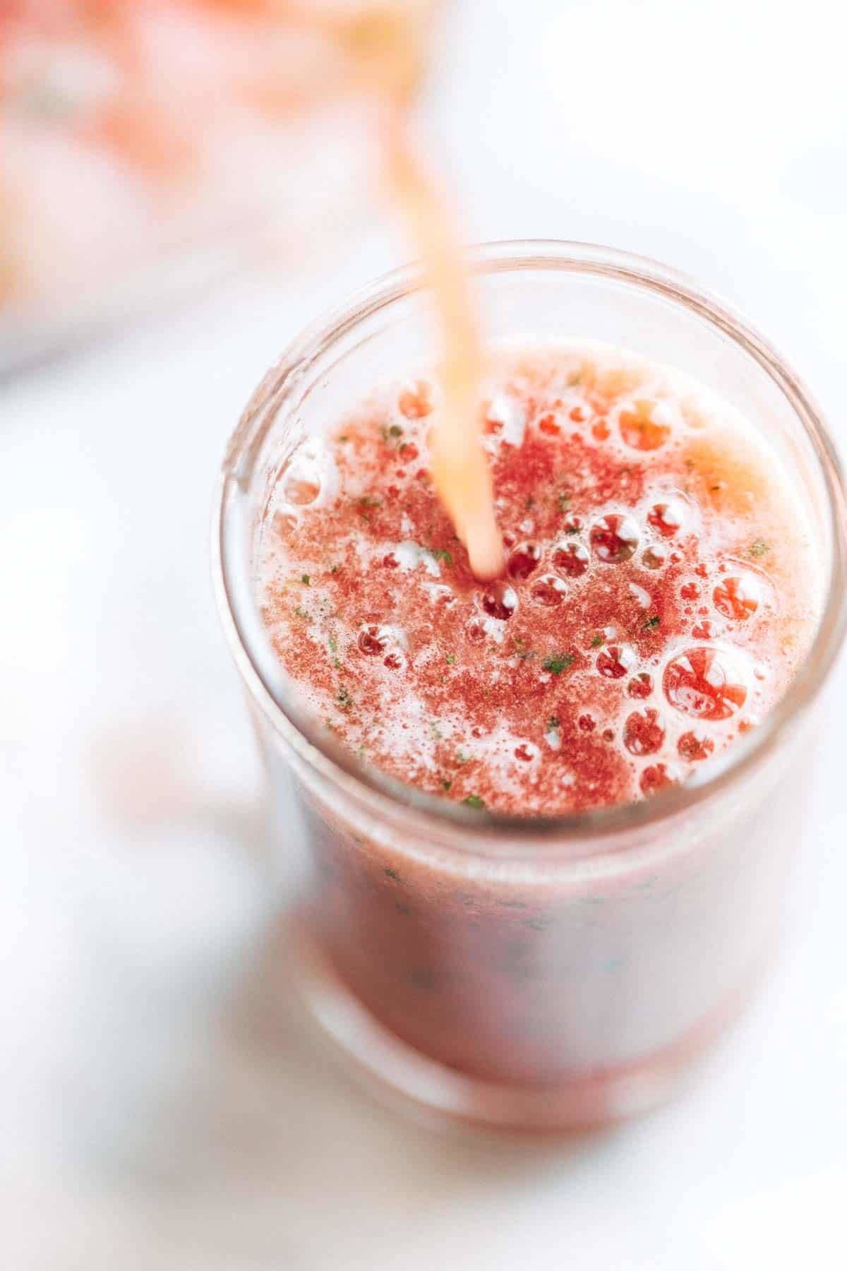 Smoothie pouring into a glass.