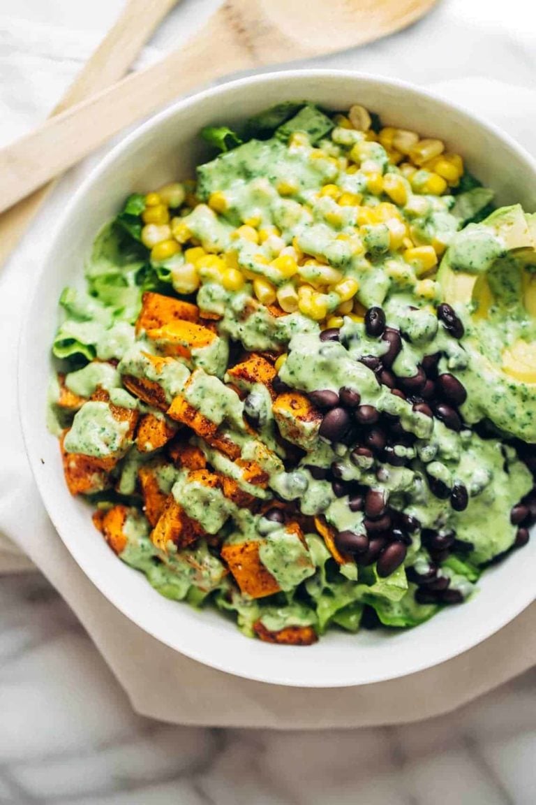 Spicy Southwestern Salad in a serving bowl with avocado dressing.