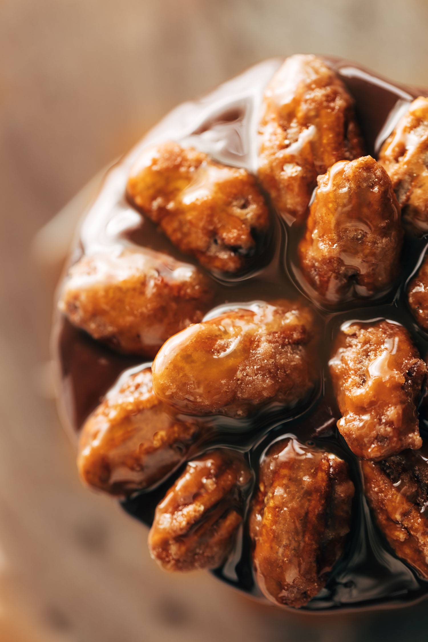 Candied pecans on top of turtle cake