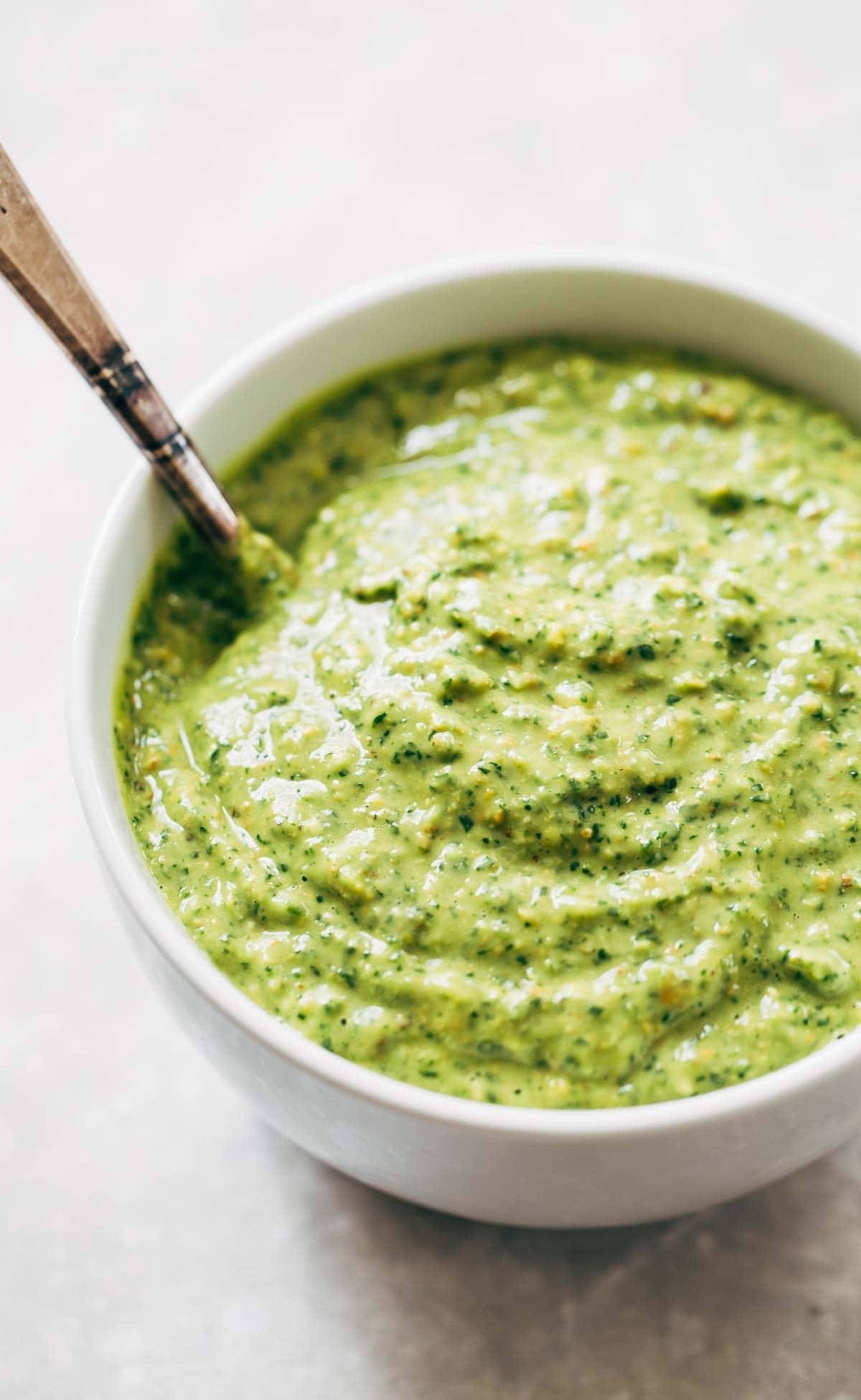 Magic Green Sauce in a bowl with a spoon.